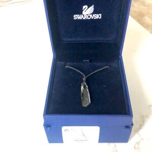 Swarovski black diamond crystal pendant tied with a black cord.